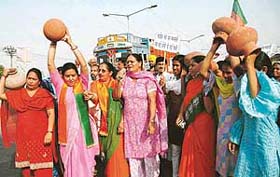 Activists of the BJP Mahila Morcha hold a protest at Colony No.5 in Chandigarh
