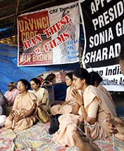 Catholic nuns offer prayers at a protest rally