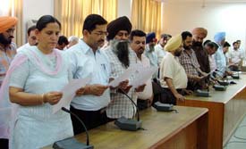 Participants take oath to fight terrorism at a function to mark anti-terrorism day at