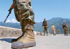 Paramilitary troopers block the road leading to the conference centre overlooking the famous Dal Lake in Srinagar on Monday