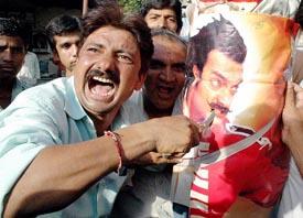 Activists of Meghani Nagar Youth Circle protest against film actor Aamir Khan for his support to the NBA movement in Ahmedabad on Friday.