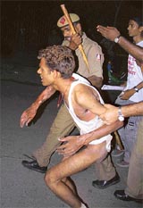 Rishiraj Ranjan, who attempted self-immolation, being carried to hospital by a Delhi Police cop at Ramlila Ground, New Delhi