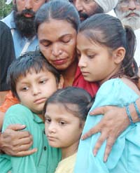 Mumtaz hugs her three children after their release from jail in Amritsar