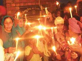 Residents of Manoli village celebrate the opening of the Manoli-Premgarh bridge