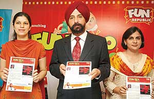 Mr J.S. Jolly, senior vice-president, Fun Republic (centre) launches in-house news magazine, "Fun-Doo Times" at Shivalik Hotel in Sector 17, Chandigarh, on Saturday.