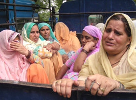 Mourning relatives of a woman who allegedly committed suicide in Mohali on Saturday.