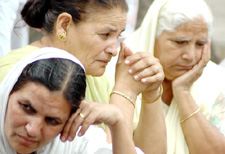 Women from terrorist-hit families of Punjab wait outside 10 Janpath to meet Congress President Sonia Gandhi in New Delhi on Saturday