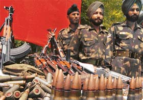 A huge cache of arms and ammunition seized by the troops from the Kashmir valley