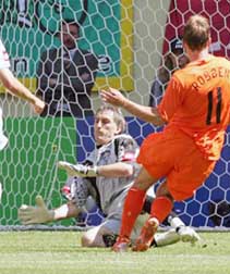 The Netherlands Arjen Robben (right) scores his teams first goal as Serbia and Montenegros goalkeeper Dragoslav Jevric tries to stop the ball during their Group C World Cup 2006 soccer match in Leipzig on Sunday. 