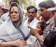 Congress President Sonia Gandhi talks to people during her visit to Rae Bareli on Saturday