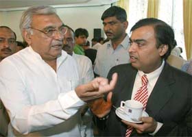Mr Bhupinder Singh Hooda, Chief Minister, Haryana, talks to Mr Mukesh Ambani, Chairman of Reliance Industries Ltd, after a news conference in Chandigarh