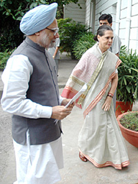 Prime Minister Manmohan Singh is received by AICC President Sonia Gandhi for the CWC meeting on price hike at 10 Janpath in New Delhi on Thursday.