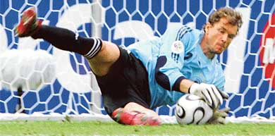 German goalkeeper Jens Lehmann stops a penalty kick by Argentinian defender Roberto Ayala during the first quarterfinal at the Olympic Stadium in Berlin on Friday