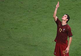 Portuguese forward Cristiano Ronaldo celebrates after scoring a kick during the penalty shootout of the quarterfinal match against England at Gelsenkirchen on Saturday. Portugal won 3-1.