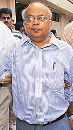 Sacked AIIMS Director, Dr Venugopal Rao, comes out after meeting of the governing body in New Delhi on Wednesday.