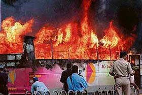 A bus set on fire by agitated Shiv Sena activists in Mumbai