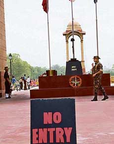 Army personnel keep vigil near Amar Jawan Jyoti behind a No Entry sign at India Gate as security is beefed up in New Delhi on Saturday.