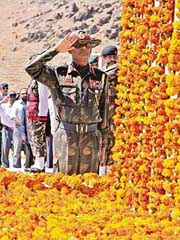 Lieut-Gen J.K. Mohanty salutes in front of a war memorial during Vijay Diwas celebrations in Drass on Wednesday. 
