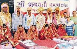 Six couples who got married at a ceremony organised by the Maa Bhagwati Club in Ludhiana on Sunday.