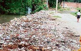 Garbage lies scattered along a seasonal rivulet in Kajehri village