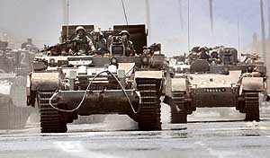 Israeli infantry soldiers ride armoured personnel carriers into Lebanon at the Israeli Lebanon border on Wednesday