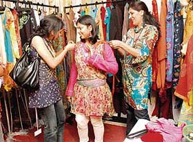 Visitors to August Carnival at Shivalik View try out some costumes