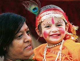 A kid dressed as Lord Krishna during the Janmashtami celebrations at Shri Radha Krishan Sidh Temple at Panjab University, Chandigarh