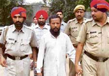 Mohammad Sedur Rehman is taken to a court in Bathinda on Friday