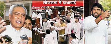 TV image of agitated RJD MPs walking towards the well of the Lok Sabha; and talking to the Press outside Parliament House, JD MP Prabhunath Singh (left) and RJD MP Sadhu Yadav  in New Delhi on Wednesday