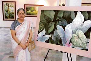Pushpa Bagrodia with her paintings at Art Folio