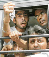 Medical students and doctors raise slogans after their court arrest during an anti-reservation protest rally organised in New Delhi on Friday