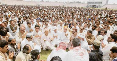 Supporters of Nawab Akbar Khan Bugti, who was killed in a military operation last week, offer prayers during his funeral service in Quetta