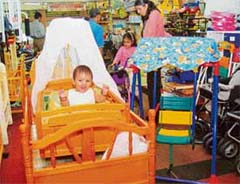 CRADLE SNATCHER: Baby malls are offering a wide arrey of products.
