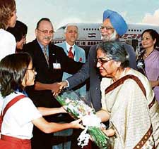 Prime Minister Manmohan Singh and his wife Gursharan Kaur are greeted by a Cuban girl on their arrival at Jose Marti International Airport in Havana on Thursday