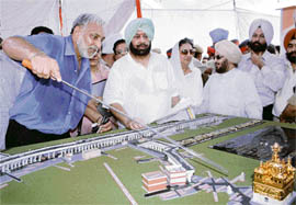 Municipal Commissioner K.S. Kang explains the elevated road model to Capt Amarinder Singh in Amritsar.