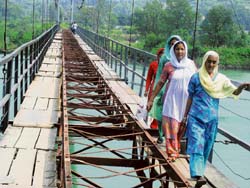 Every day people risk their lives to cross the Handola bridge.