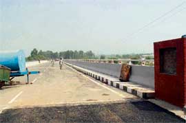 The strategic Dera Bassi-Ramgarh bridge on the Mindkali river awaits inauguration by a VIP.