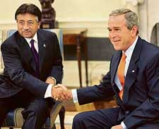 US President George W. Bush shakes hands with Pakistan President Pervez Musharraf in the Oval Office of the White House in Washington on Friday. 