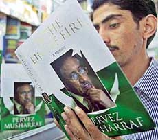 A Pakistani reads a copy of a book written by Pervez Musharraf titled In the Line of Fire: A Memoir, in Islamabad on Monday. 