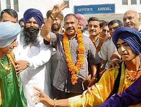 Mr Harjit Singh Grewal, national secretary of the BJP, Mr V. Radhakrishnan, minister of Central Province in Sri Lanka, and Vineet Joshi, a BJP youth leader, at the Chandigarh airport on Tuesday
