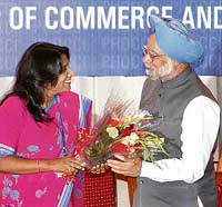 Mrs Sushma Barlia, President, PHD Chamber of Commerce and Industry, greets Prime Minister Manmohan Singh with a bouquet, at the inaugural ceremony of the Chief Ministers Conclave in Chandigarh on Thursday. 