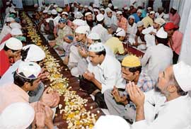 Fasting in piety: Prayers before breaking the fast at Ramzan.