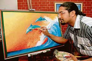 Micheleangelo Francis gives finishing touches to his painting