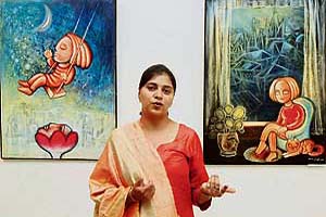 Kavita Singh with her paintings