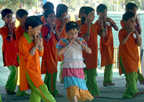 Kashmiri children dance during a memorial ceremony in Uri, 105 km north of Srinagar on Sunday, to mark the anniversary of the earthquake in 2005.