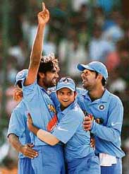 Munaf Patel celebrates with Suresh Raina and Yuvraj Singh after the dismissal of Kevin Pietersen during the ICC Champions Trophy match between India and England at the Sawai Man Singh Stadium in Jaipur on Sunday.