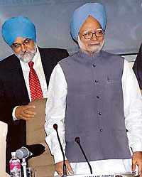 Prime Minister Manmohan Singh and Planning Commission Deputy Chairman Montek Singh Ahluwalia at a meeting of the Planning Commission in New Delhi on Wednesday.