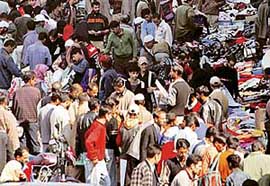 People go shopping in a market ahead of Id-ul-Fitr in Srinagar on Monday.