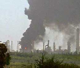 Smoke billows from a refinery that caught fire at Reliance Petrochemicals in Jamnagar on Wednesday.