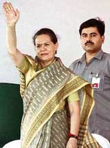 Congress president Sonia Gandhi waves to her party supporters at a rally in Chakur, Latur district, Maharashtra